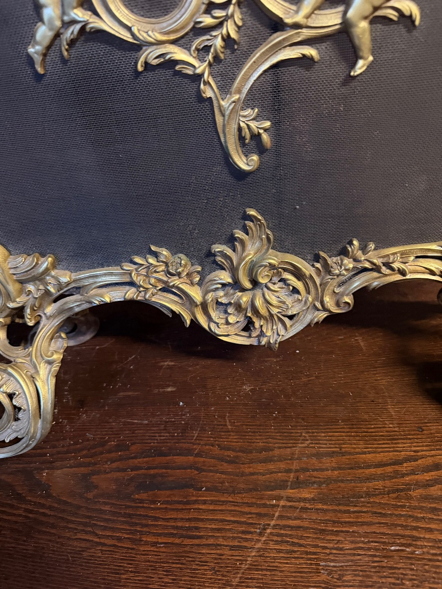 Pare étincelle en bronze doré à décor de chérubins -photo-1