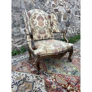 Fauteuil à oreille de style régence 