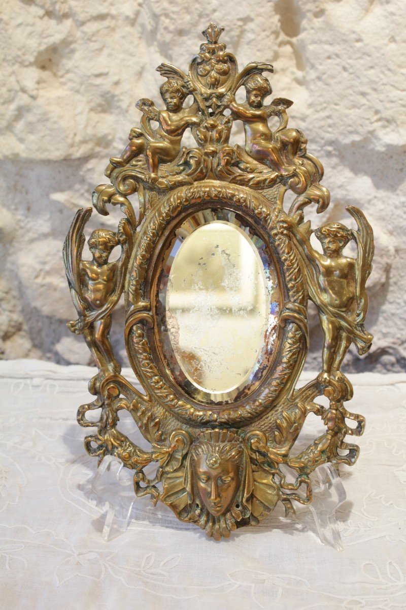 Bronze Mirror Decorated With Cherubs, Ribbons, Flowers And Mascaron Late 19th Century