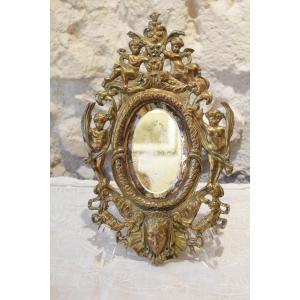 Bronze Mirror Decorated With Cherubs, Ribbons, Flowers And Mascaron Late 19th Century