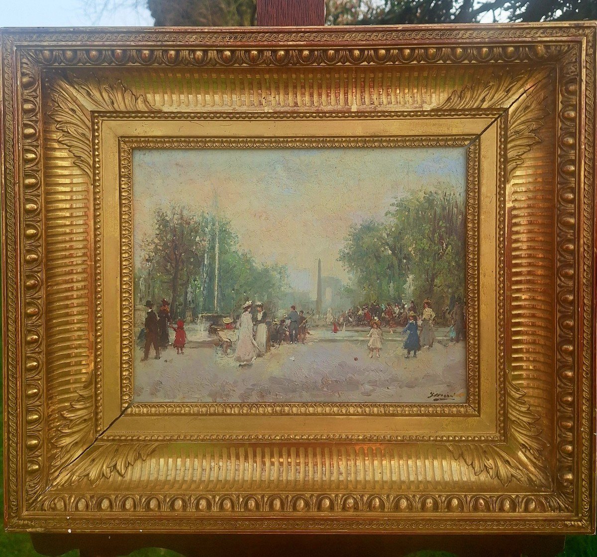 Huile sur panneau d'acajou signé "Promenade au jardin des tuileries"