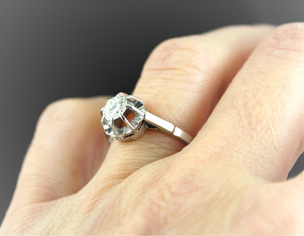 Solitaire or et platine, diamant + 0.60 ct