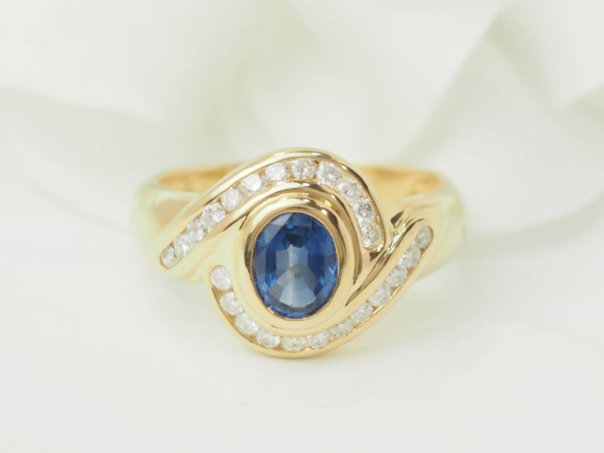Yellow Gold Swirl Ring With Oval Sapphire And Diamonds