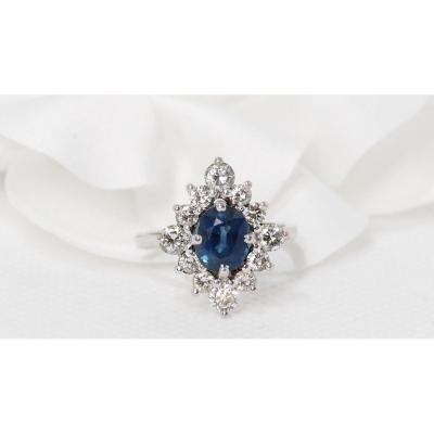 White Gold Ring Set With An Oval Sapphire And Diamonds