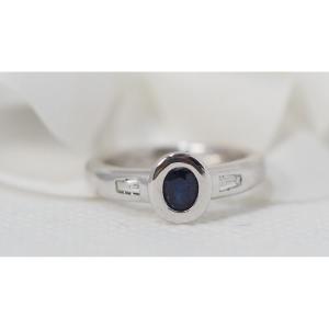 White Gold Ring Set With An Oval Sapphire And Diamonds