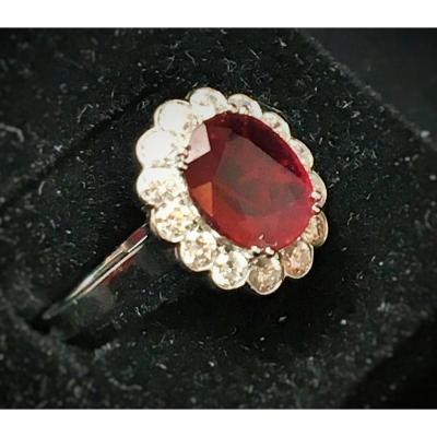 18ct Gold Ring Set With A Ruby Surrounded By Brilliants