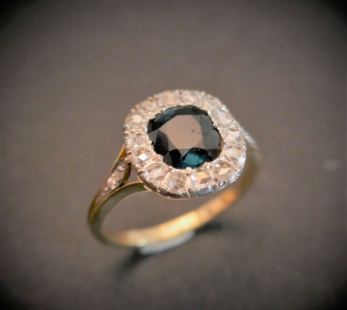 Ring Adorned With A Sapphire And Rose Cut Diamonds, Gold And Platinum.