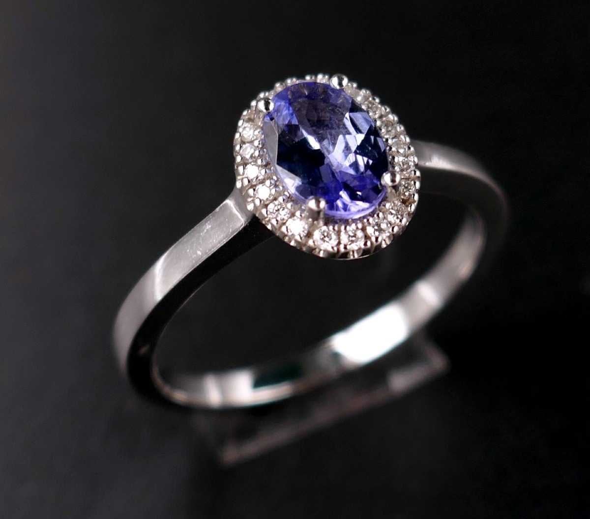 Sapphire Ring Surrounded By Diamonds, 18 Carat White Gold.