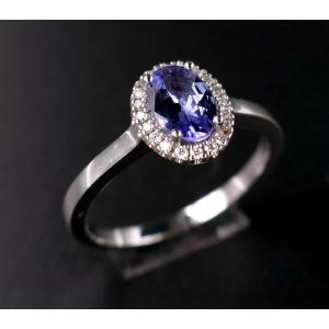 Sapphire Ring Surrounded By Diamonds, 18 Carat White Gold.