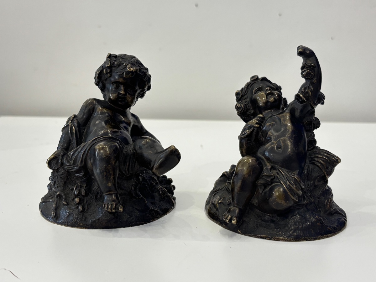 A Charming Pair Of Patinated Bronze Putti—in The Style Of Clodion 