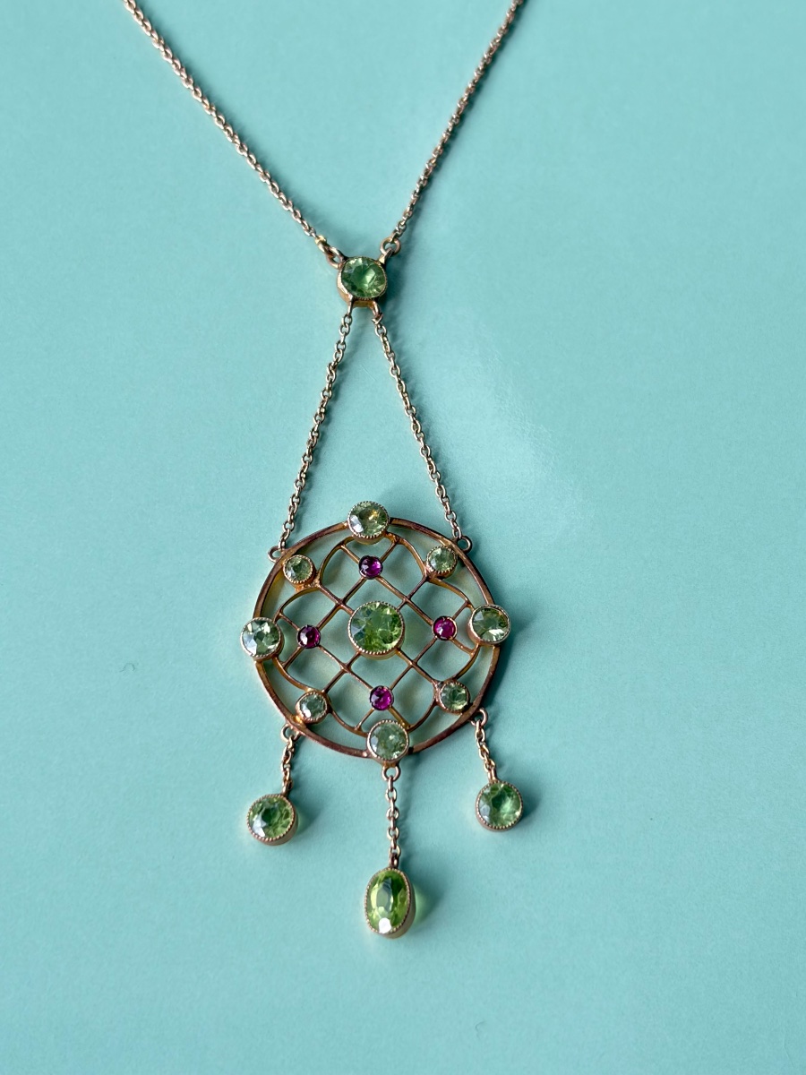 A 9-karat Gold Necklace In The Victorian And Art Nouveau Styles, Set With Peridots.