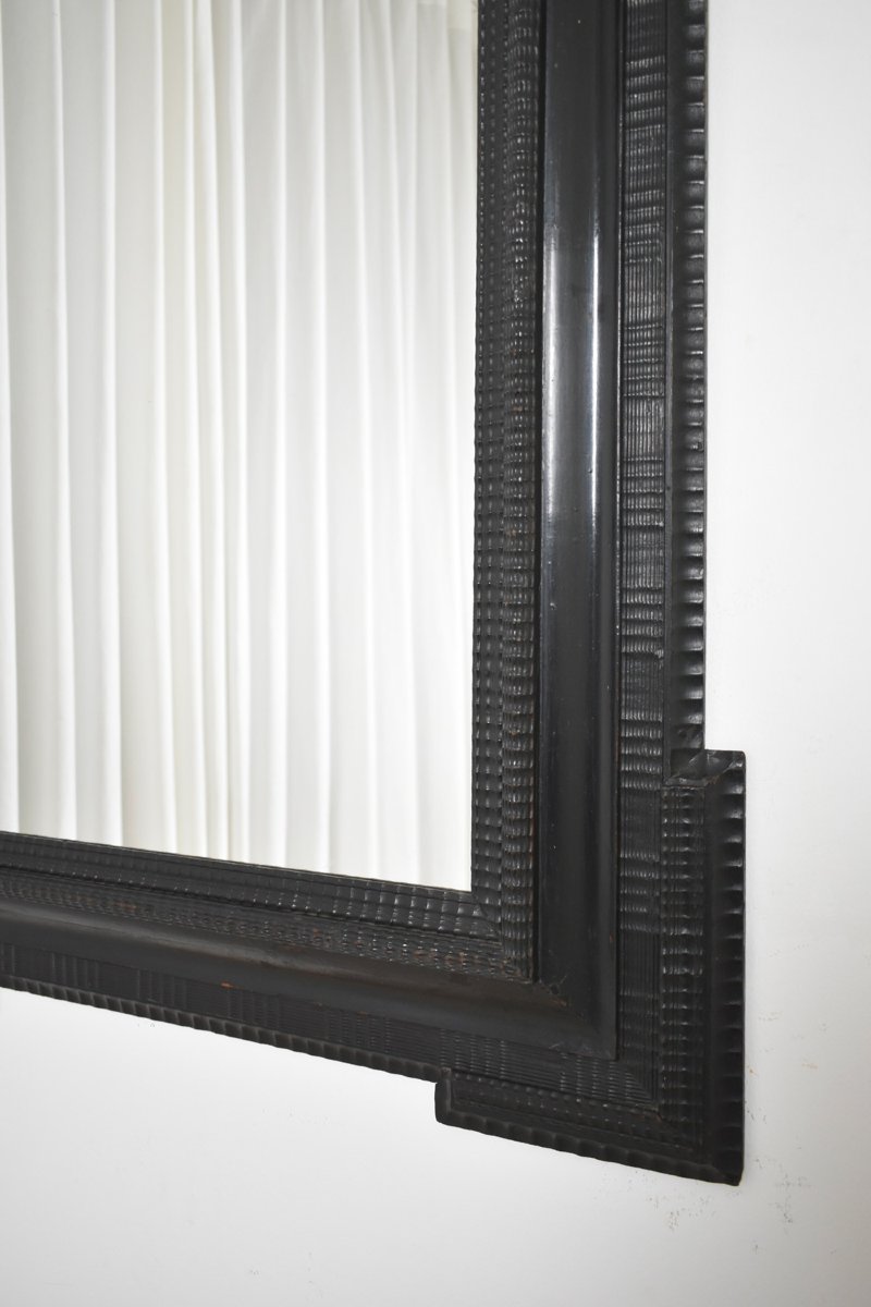 Miroir en bois ébénisé sculpté, XIXe siècle.-photo-2