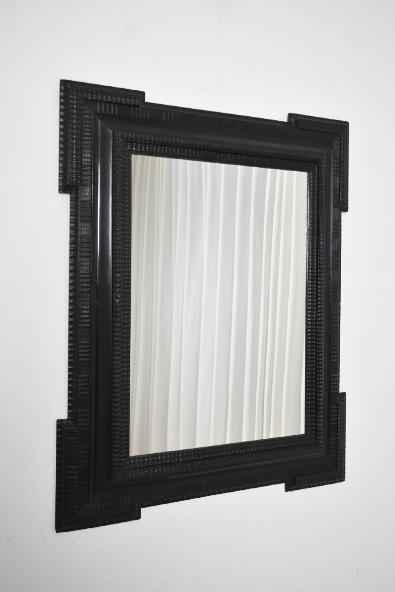 Miroir en bois ébénisé sculpté, XIXe siècle.-photo-4