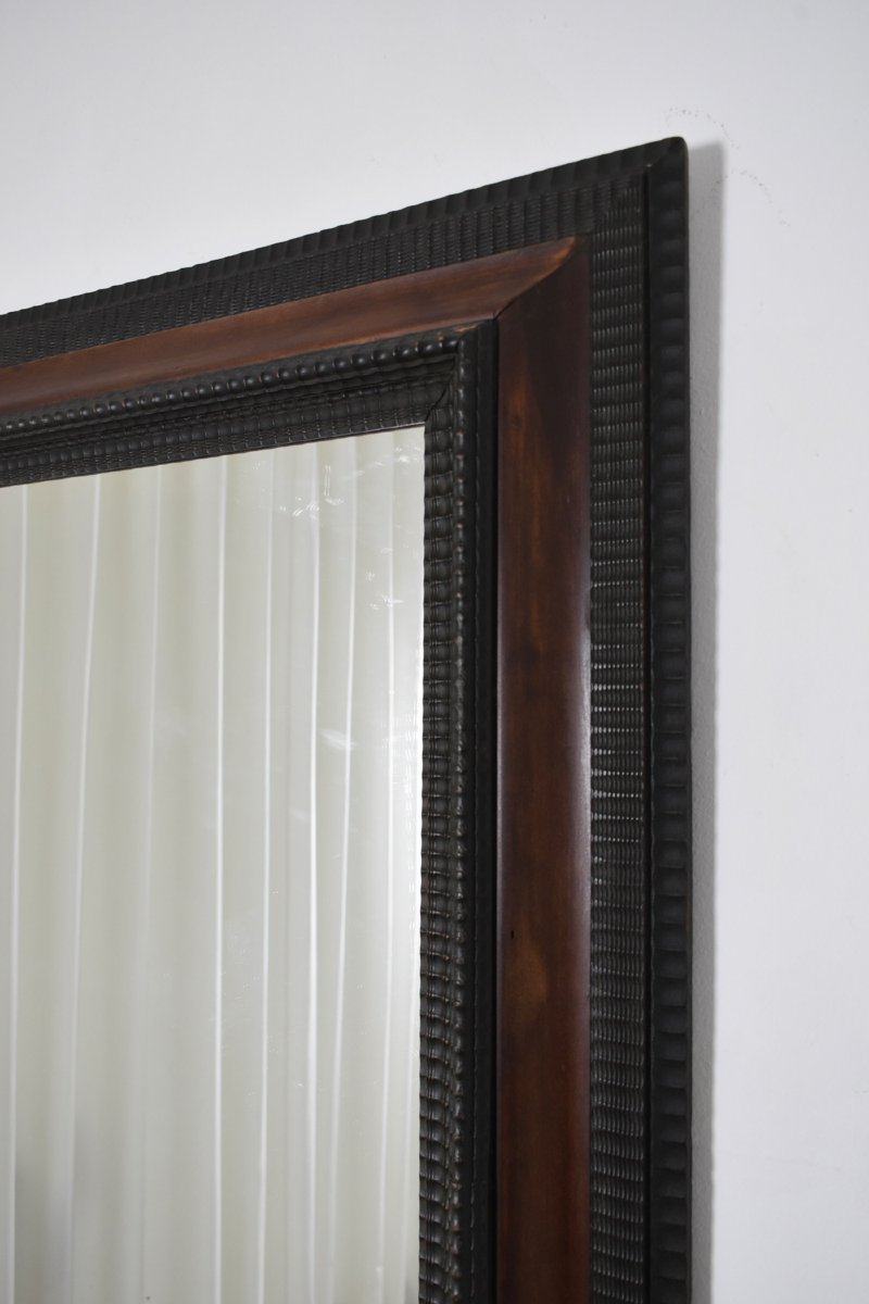 Miroir en bois ébénisé sculpté et écaille de tortue en trompe-l'œil, XIXe siècle.-photo-1