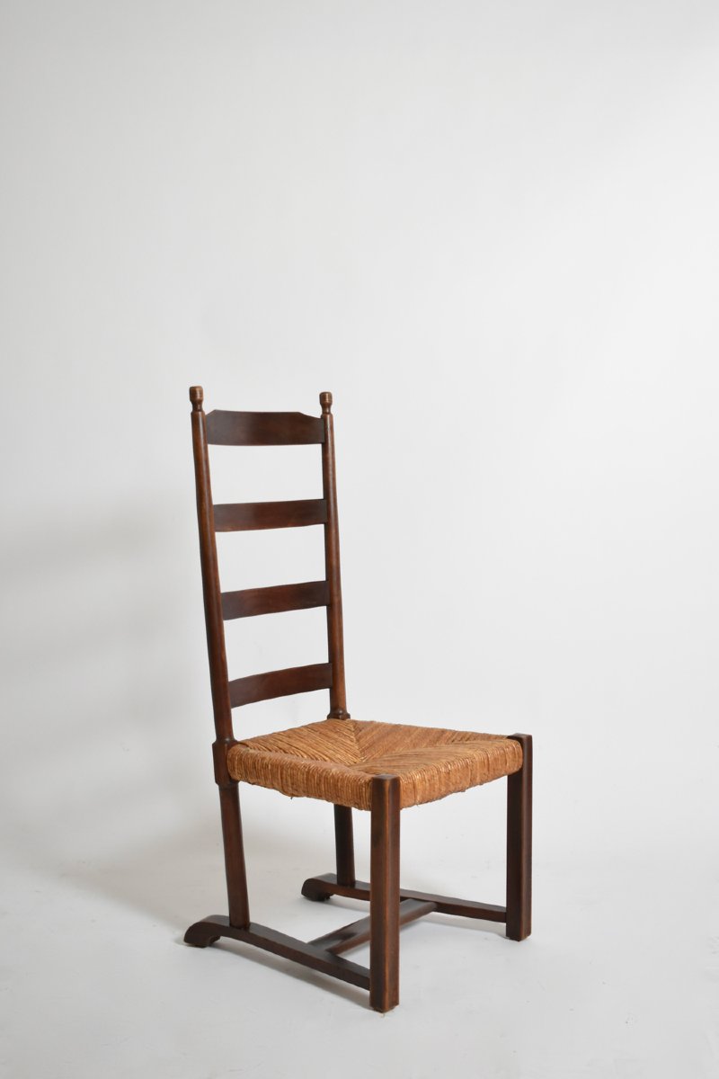 Fauteuil bas en bois et paille, années 1950.