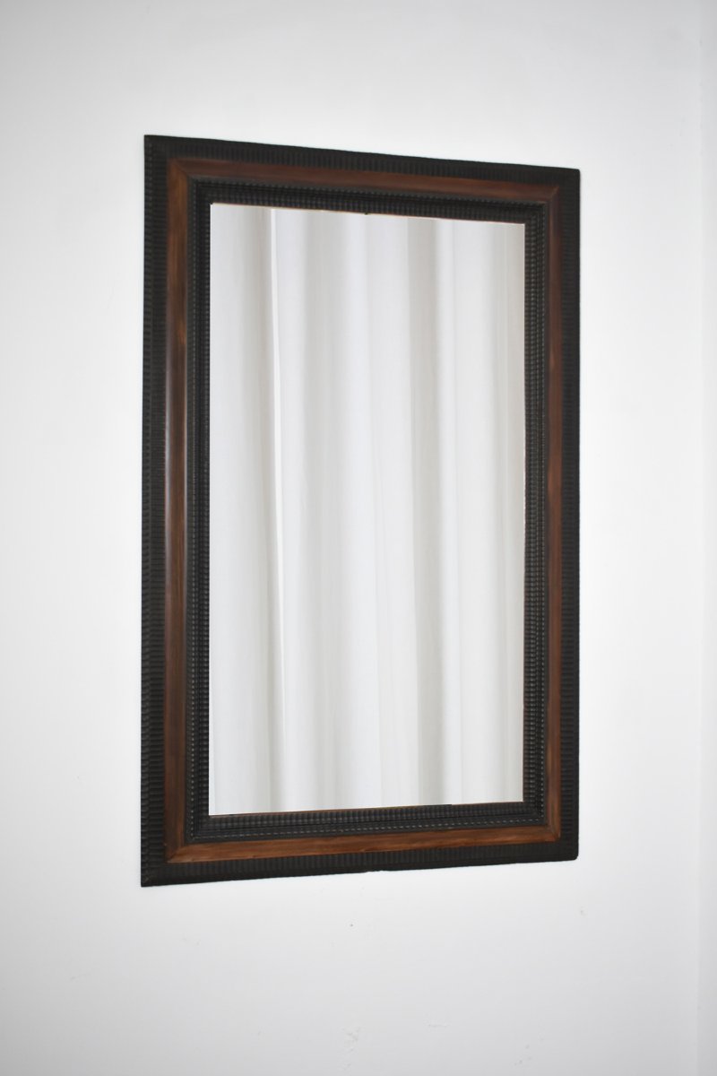 Carved Ebonised Wood Mirror And Trompe l'Oeil Turshell, XIXth C.