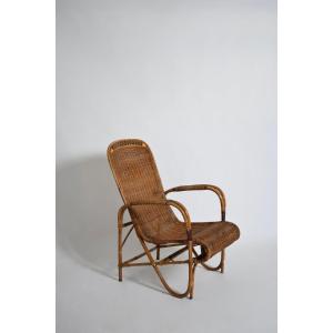 Fauteuil à haut dossier en rotin et osier, années 1950.