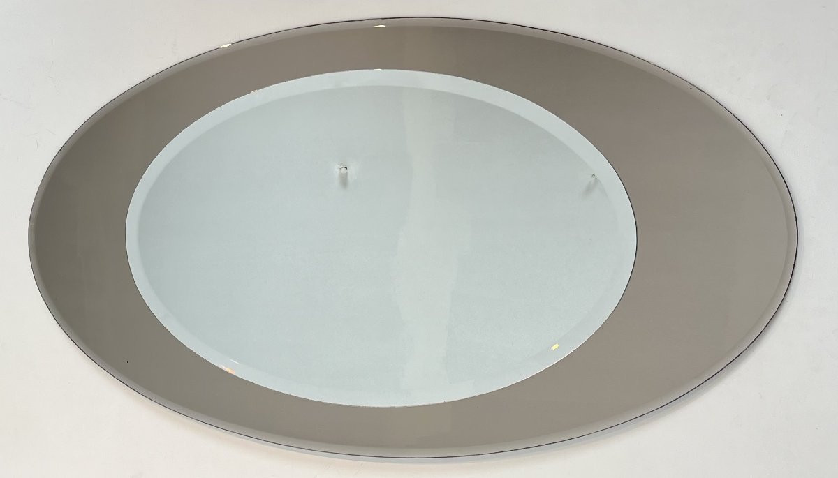 Important miroir de forme ovale à positionner horizontalement. Travail Italien de Fontana Arte.-photo-8