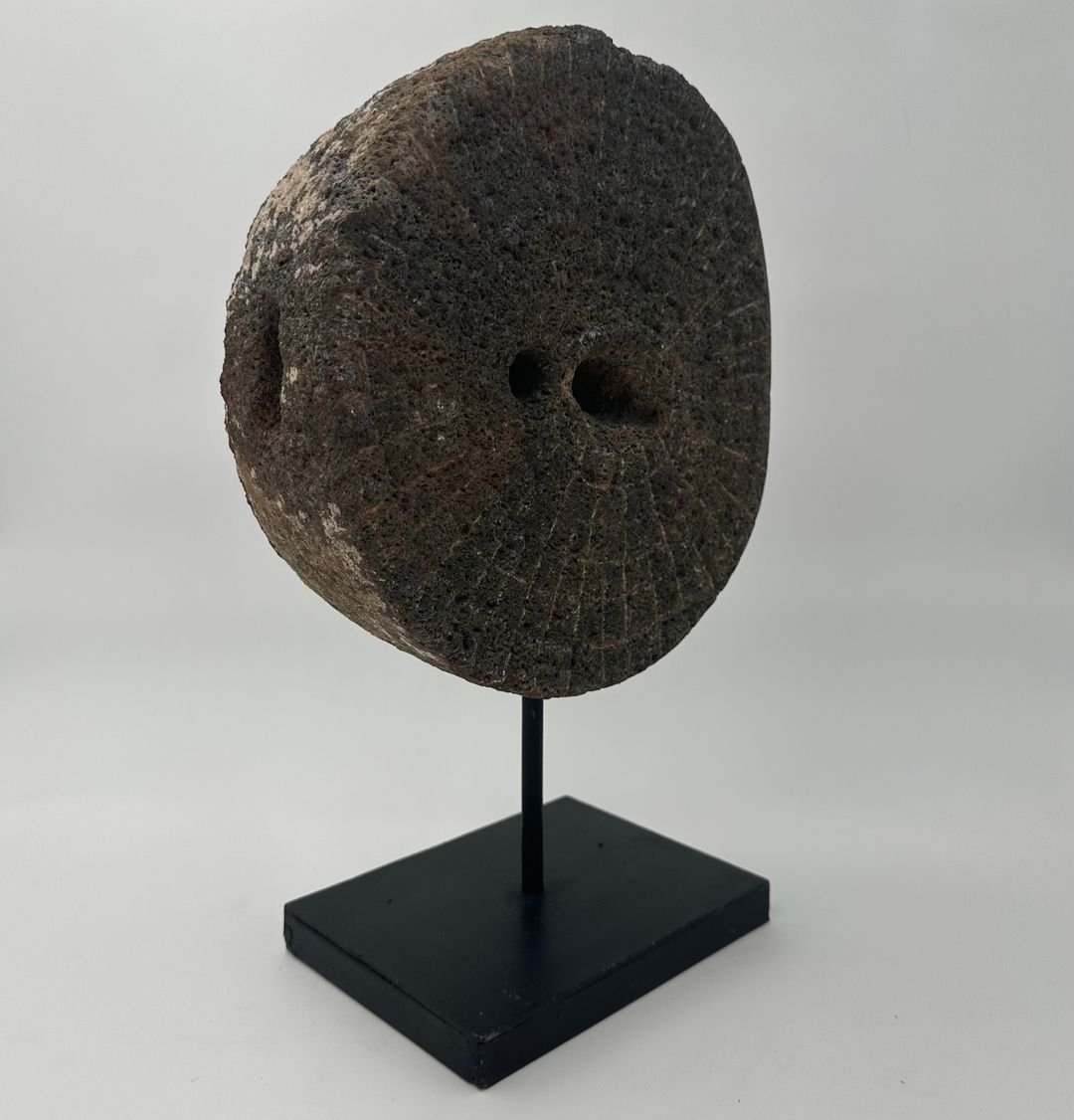 Decorative Element Made Of A Millstone On A Steel Base-photo-2