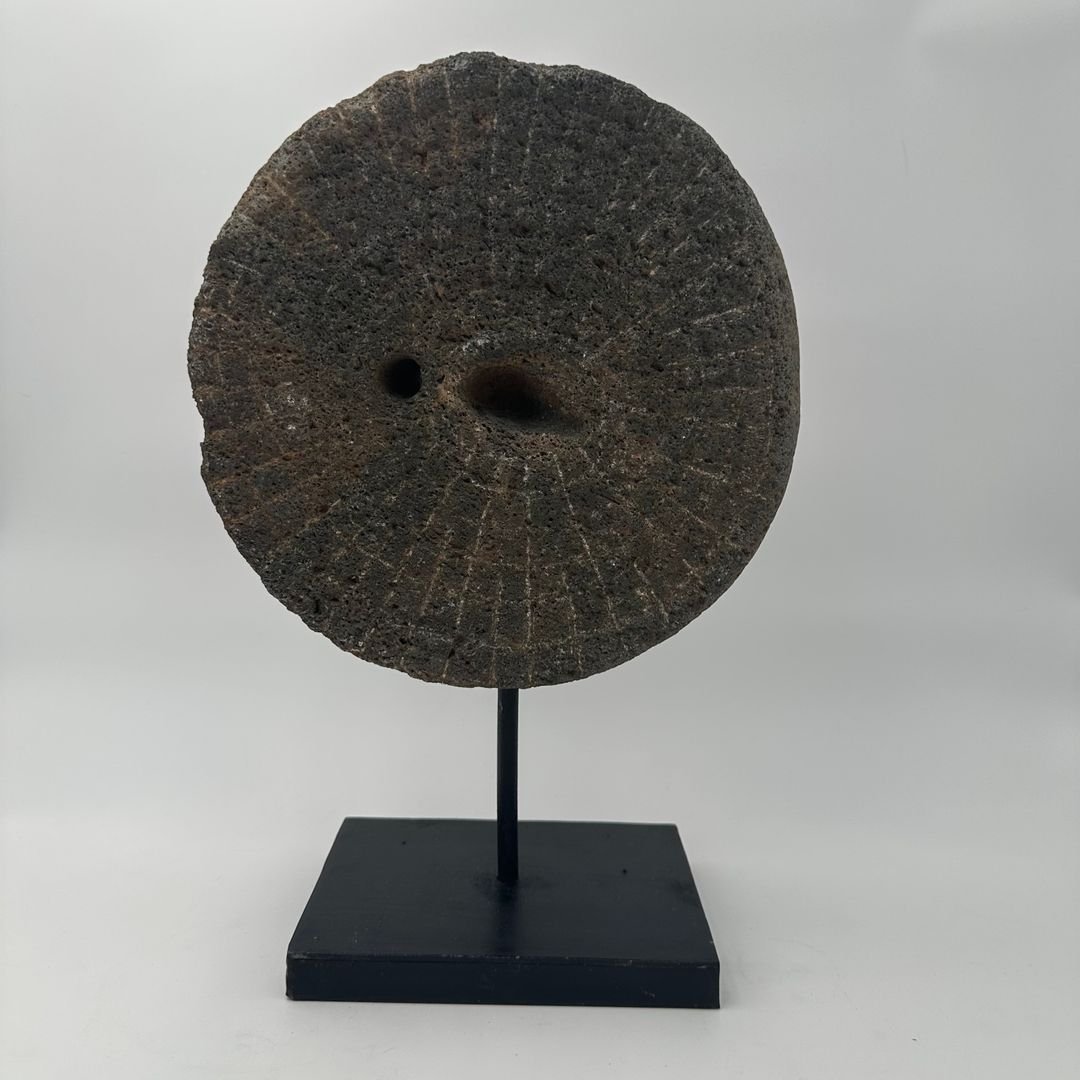 Decorative Element Made Of A Millstone On A Steel Base-photo-8