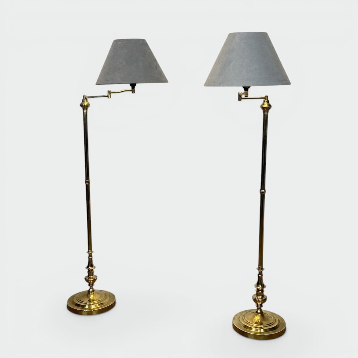 Pair Of Brass Floor Reading Lamps With Articulated Arm And Grey Velvet. French Work In The Mann