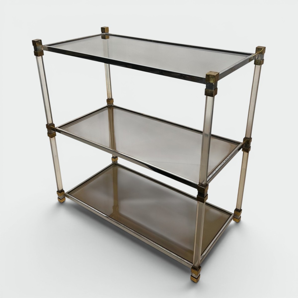 Lucite Shelf Unit With Three Smoked Glass Tiers And Brass Ends. French Work. Circa 1970