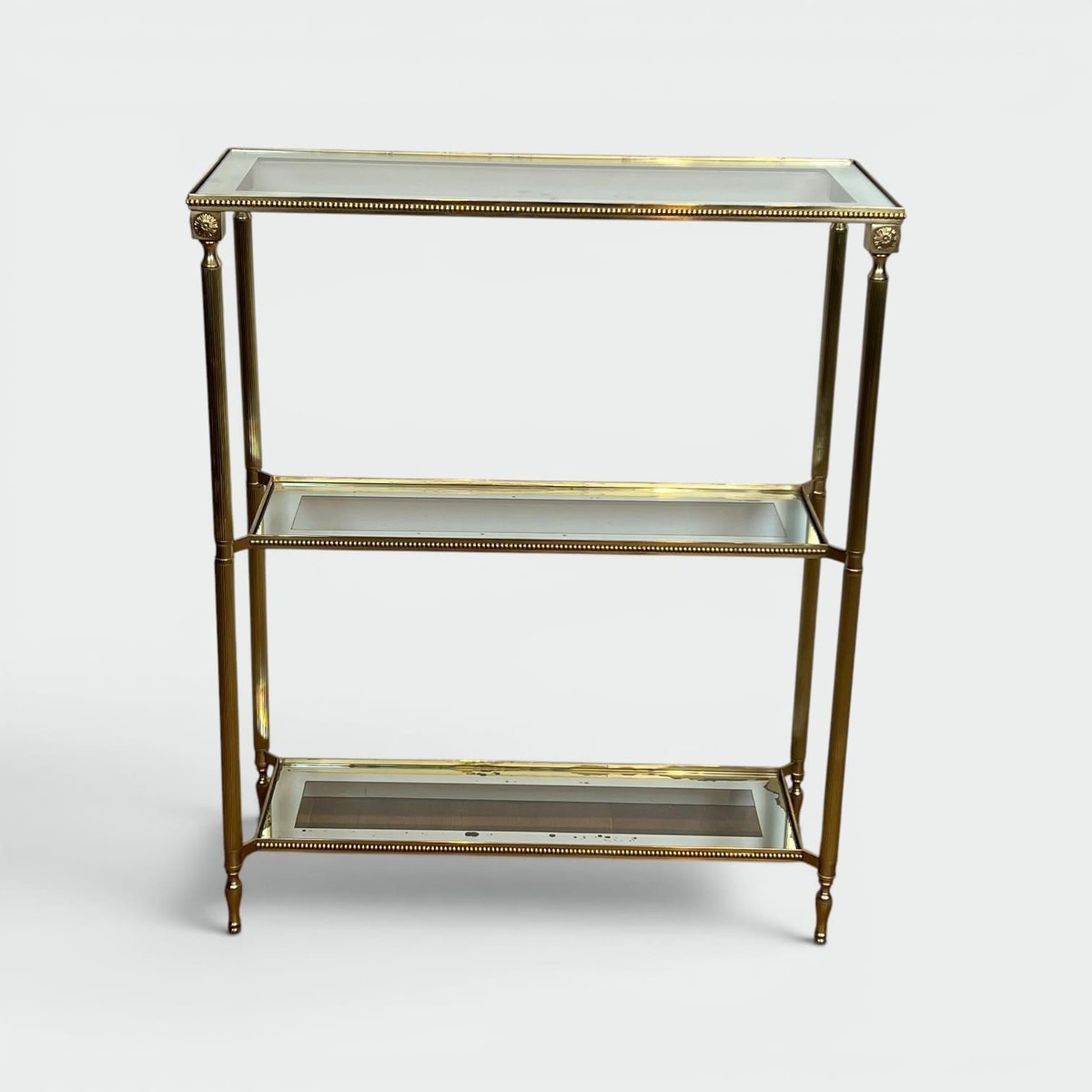 Three-tier Brass Console With Beaded Frieze. Mirror-bordered Glass. French Work In The Style Of