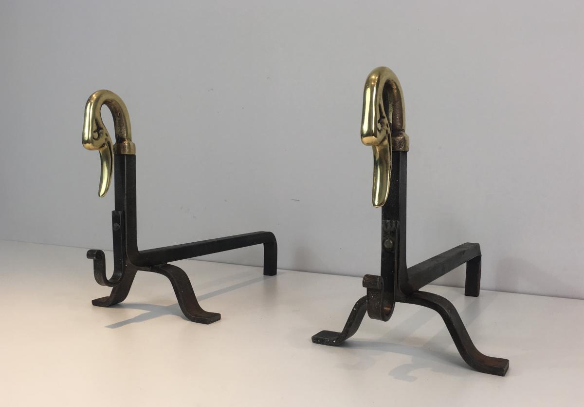 In The Style Of Maison Jansen. Pair Of Iron And Brass Andirons With Duck Heads. French. Circa 1