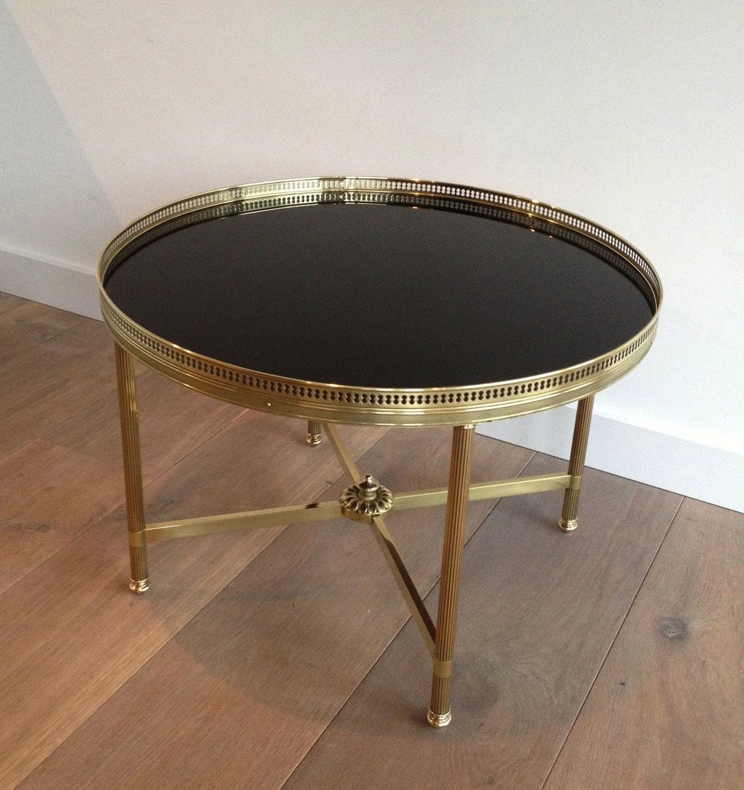 Maison Bagués. Neoclassical Style Round Brass Coffee Table With Black Lacquered Top. Circa 1940