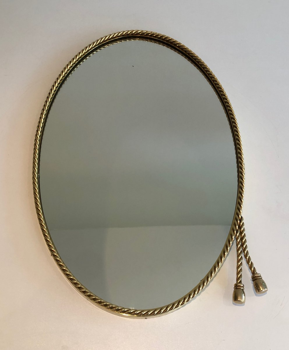 N The Style Of Maison Bagués. Oval Brass Mirror Surrounded By A Cord Decorated With 2 Pompoms. -photo-2