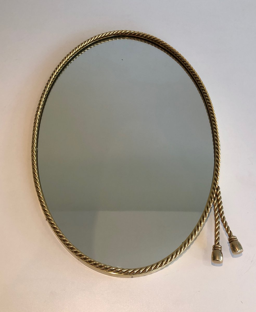 N The Style Of Maison Bagués. Oval Brass Mirror Surrounded By A Cord Decorated With 2 Pompoms. -photo-7