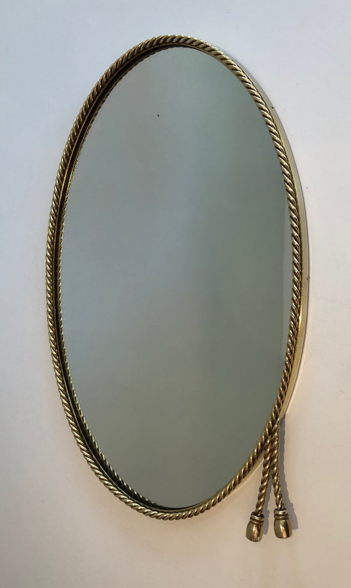 N The Style Of Maison Bagués. Oval Brass Mirror Surrounded By A Cord Decorated With 2 Pompoms. -photo-8