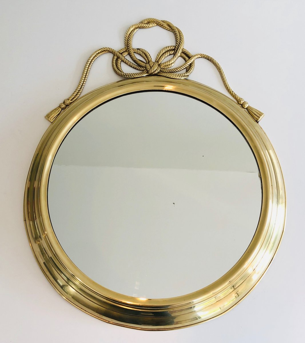  Decorative Oval Brass Mirror With Large Noddles On Top. French. Circa 1970