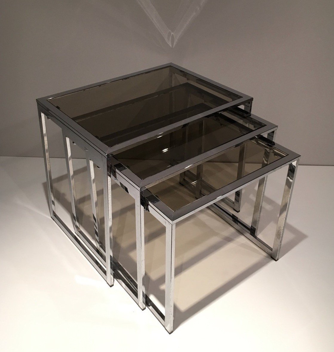 Set Of 3 Chromed Nesting Tables With Smoked Glass Shelves. French Work. Circa 1970