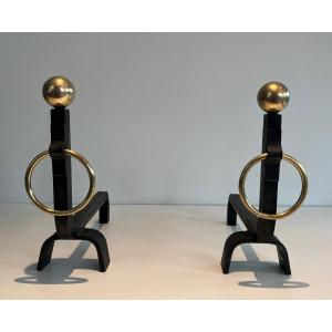 Pair Of Wrought Iron And Brass Andirons. French Work In The Taste Of Jacques Adnet.