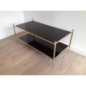 Table basse de style néoclassique en bronze et laiton à double plateaux de verres laqués noirs.