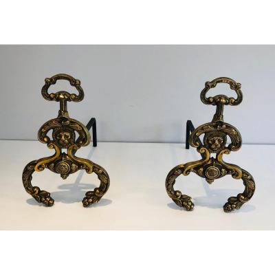 Pair Of Neoclassical Style Bronze And Wrought Ironandirons With Lions Faces. French. Circa 1940