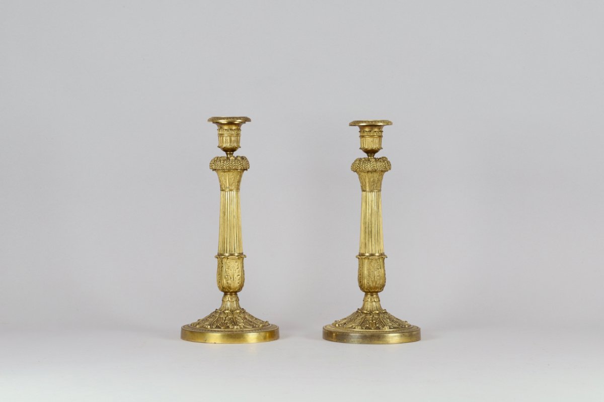 Paire de flambeaux en bronze doré