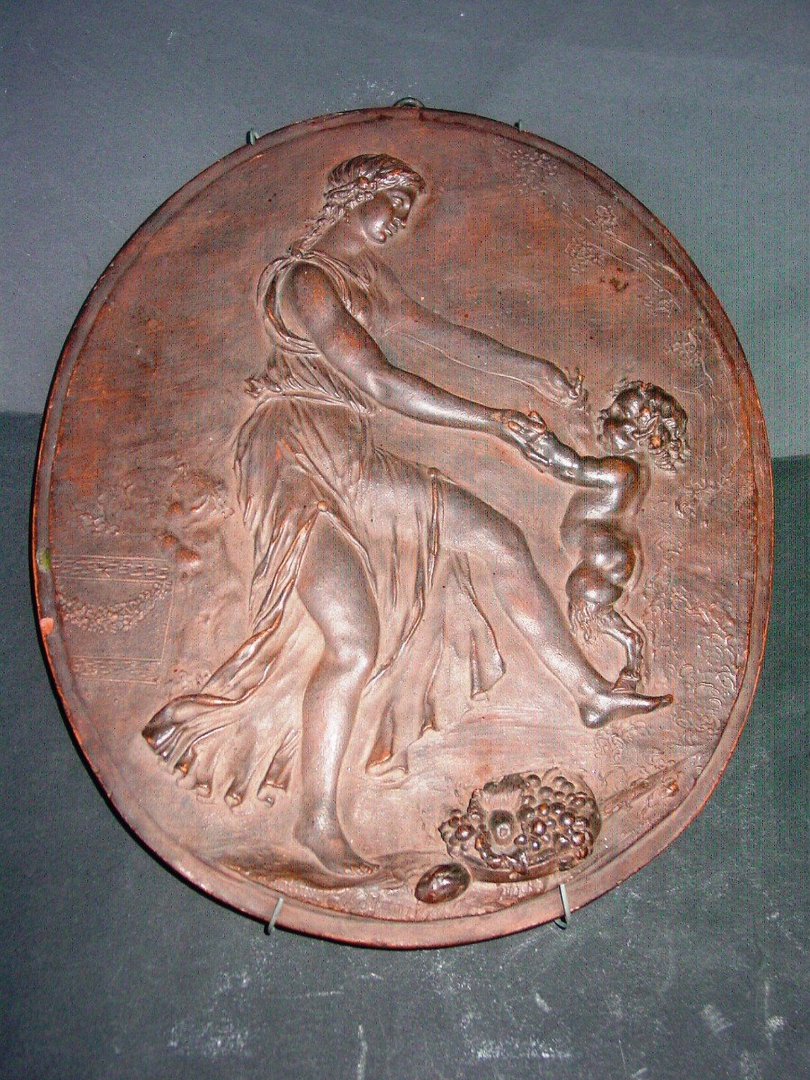 From After Clodion, Medallion In Earth From The 19th Century: Bacchante & Satyr