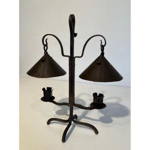 Wrought Iron Candlestick With Two Lights Topped With Riveted Conical Cups. French Work.