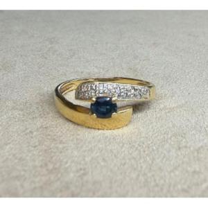 Ring With An Intertwined Sapphire