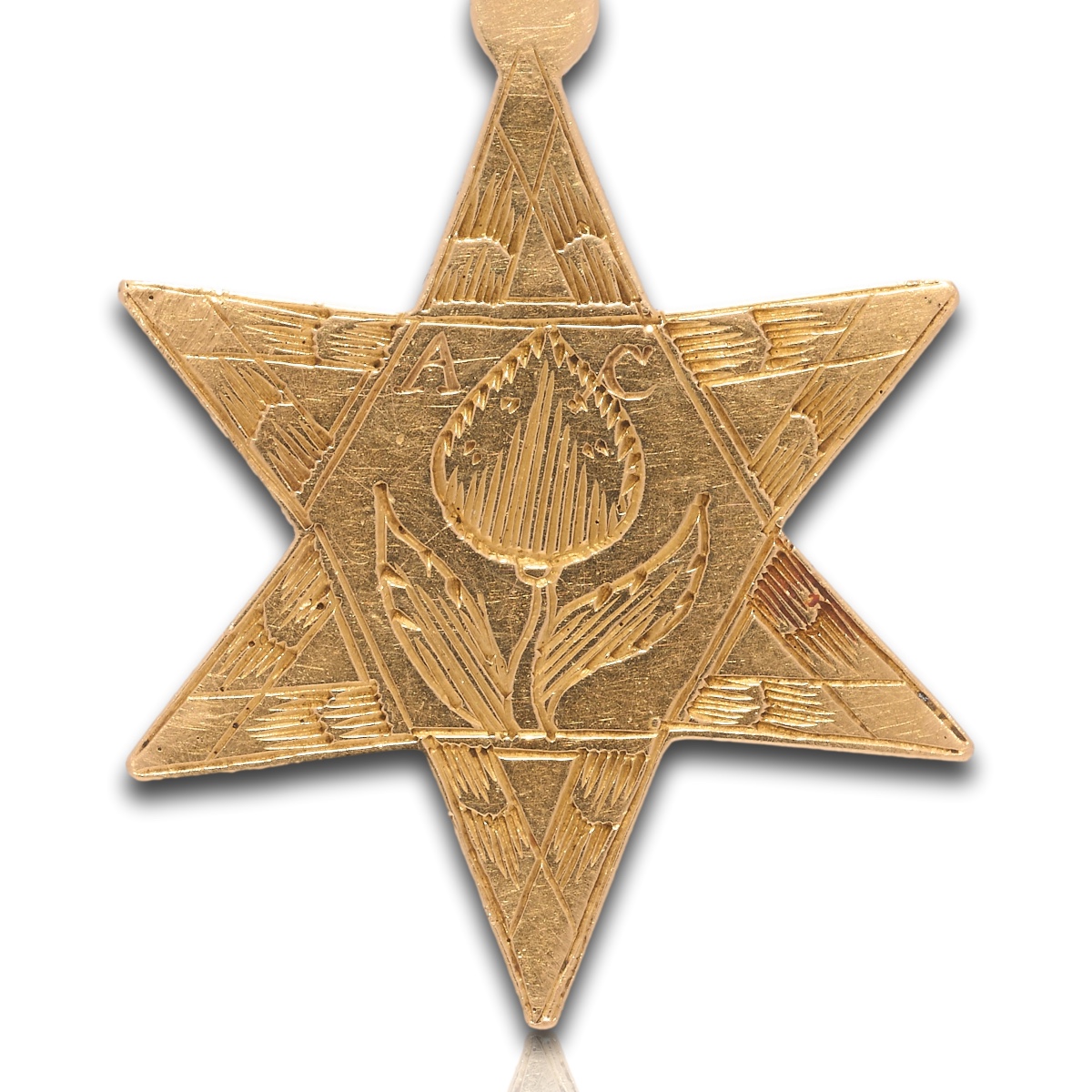 Gold Star Pendant Engraved With Foliate Ornament. Dutch, Late 17th Century.