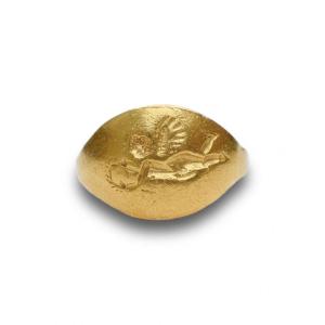 Ancient Gold Child’s Ring With A Flying Eros. Roman, 1st / 2nd Century Ad.