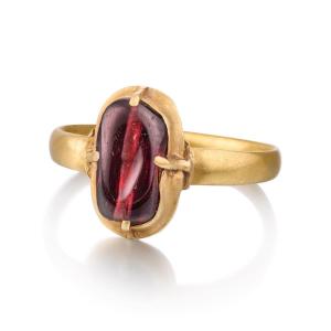 Medieval Gold Ring Set With An Ancient Drilled Garnet. English, 13th Century.