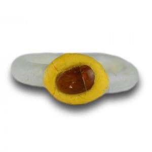 White Glass Ring With A Yellow Bezel And Amber Bead. Roman, 2nd-3rd Century Ad.