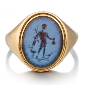 Gold Ring Set With An Ancient Nicolo Intaglio Of The Roman God Mercury.