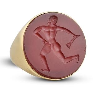 Etruscan Revival Gold Ring Set With A Carnelian Intaglio Of A Running Athlete.