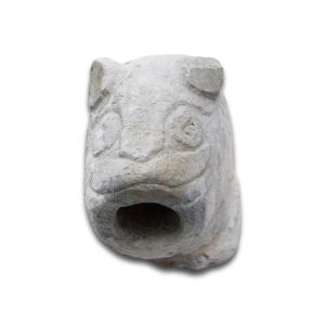Zoomorphic Stone Animal Head Water Spout. English, Probably 12th Century.