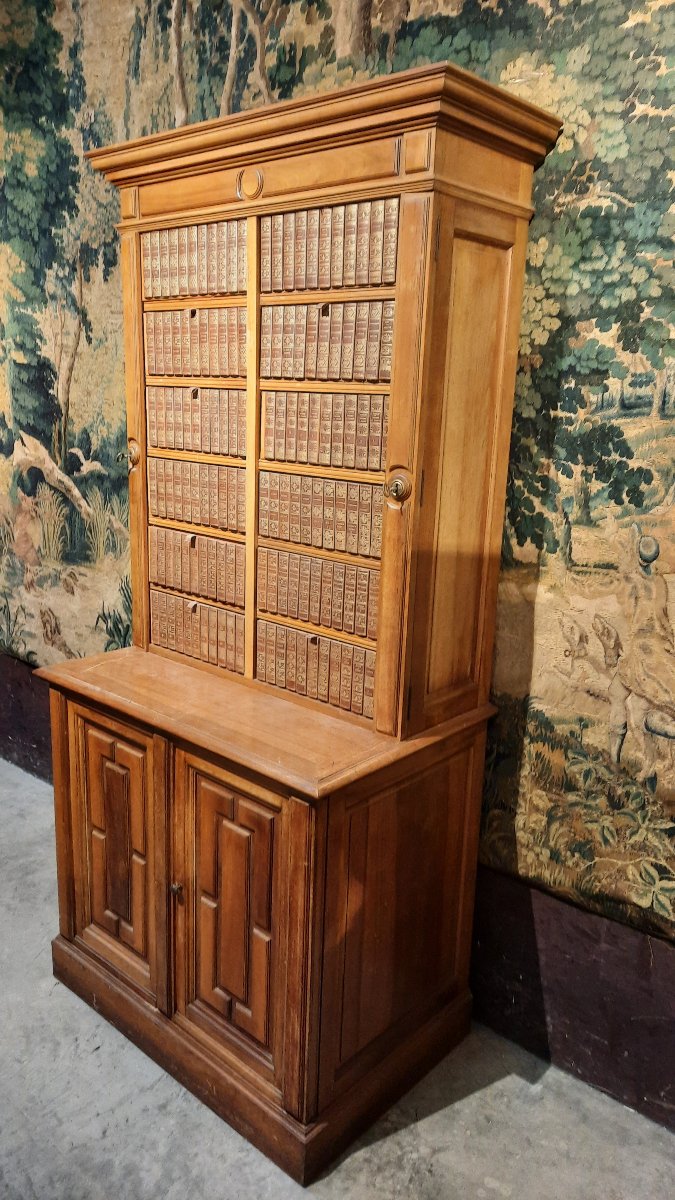 A Small Cabinet With Boxes Decorated With Books -photo-2