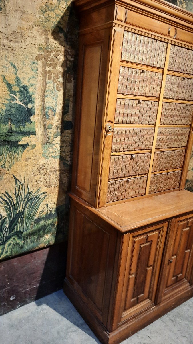 A Small Cabinet With Boxes Decorated With Books -photo-3